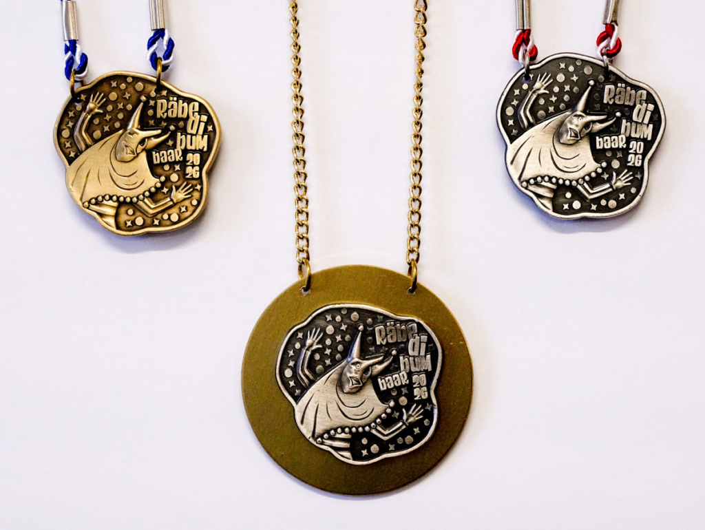 agentur guldin gmbh, Baar, Grafikagentur, Fasnachtsplakette Räbefasnacht Baar 2026, gold, silber, bronze, Fasnachtsgesellschaft Baar