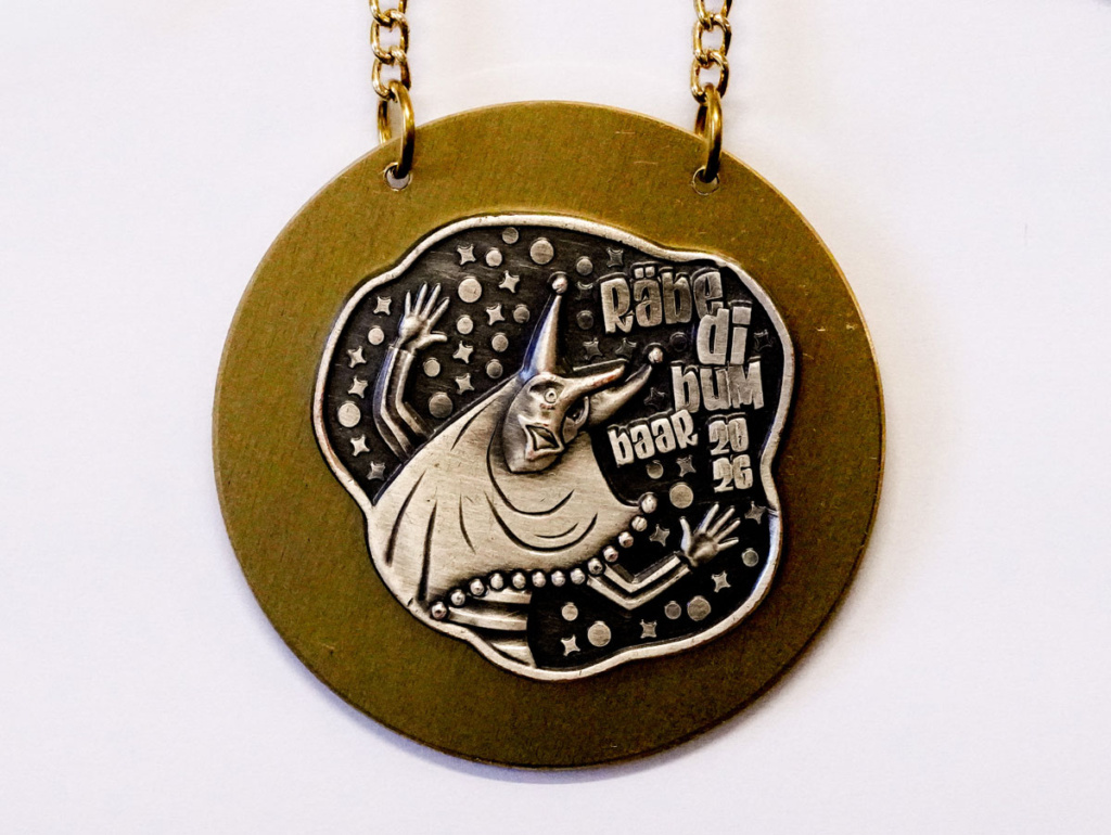 agentur guldin gmbh, Baar, Grafikagentur, Fasnachtsplakette Räbefasnacht Baar 2026, gold, Fasnachtsgesellschaft Baar